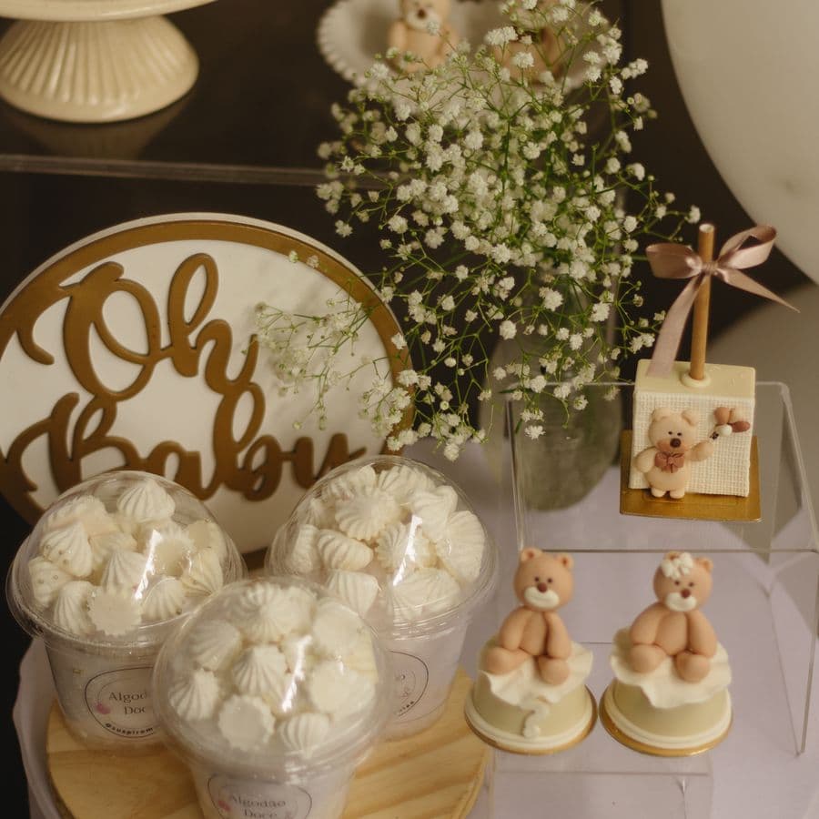 Elegant baby shower dessert table with teddy bears and florals
