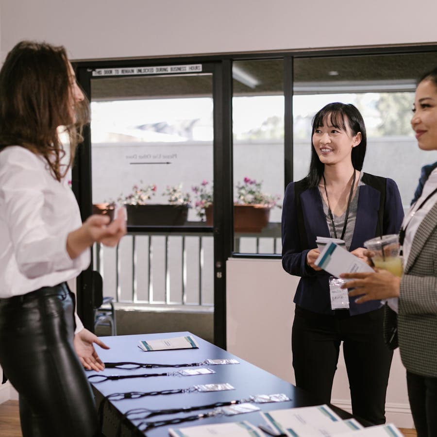 Attendees checking in at a conference registration table