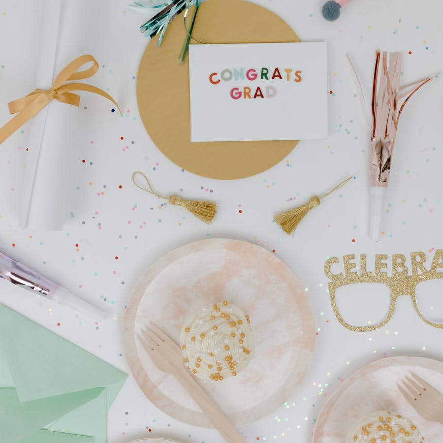 Congrats Grad party flat lay with cards and confetti