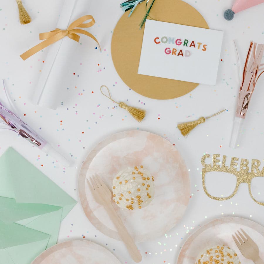 Congrats Grad party flat lay with cards and tassels