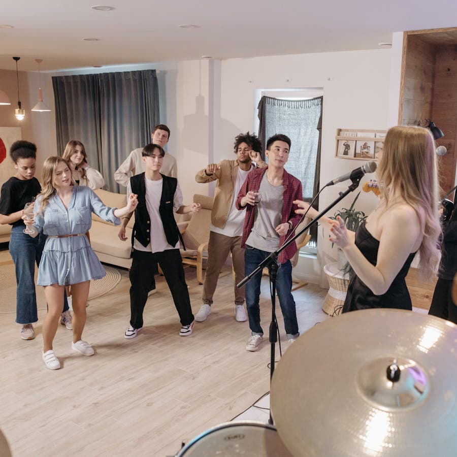 Group dancing to live music at a home party