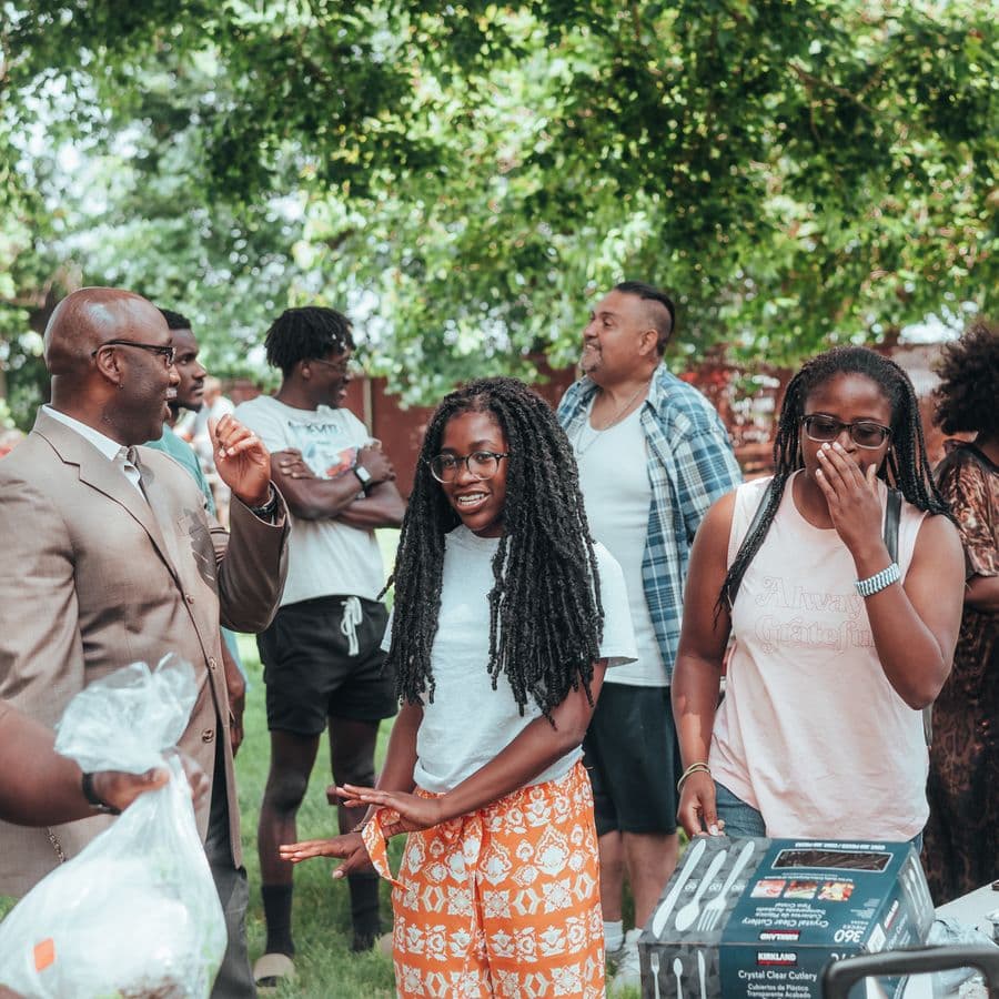 Relatives laughing together during an outdoor gathering